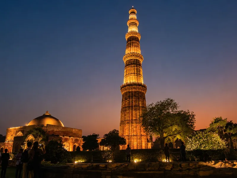 Evening heritage walk at Qutub Minar illuminated monuments, Delhi Sultanate-era sunset tour